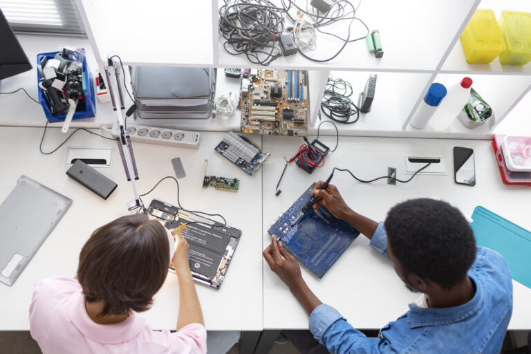 people repairing computer chips scaled